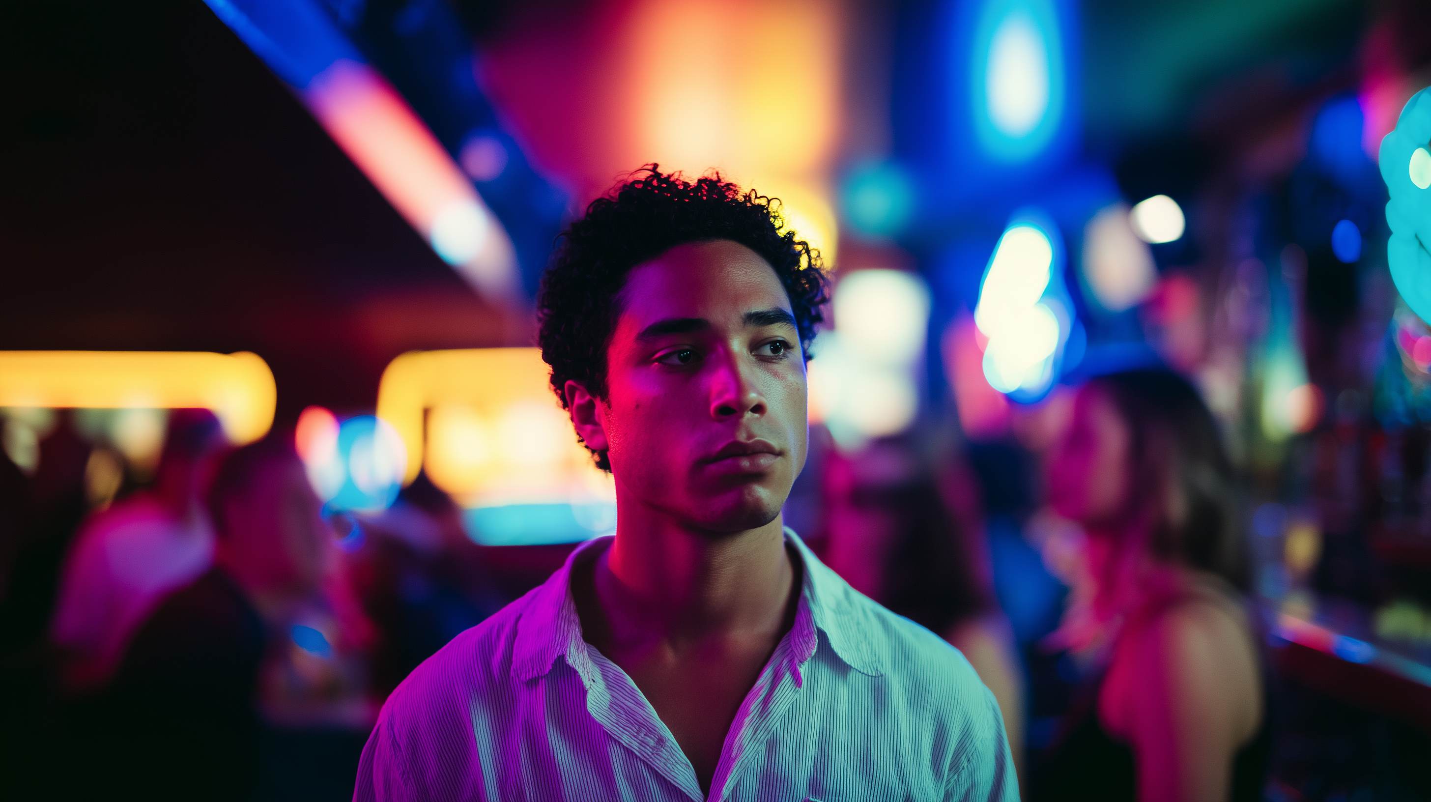 Person at a nightclub with vibrant neon lights